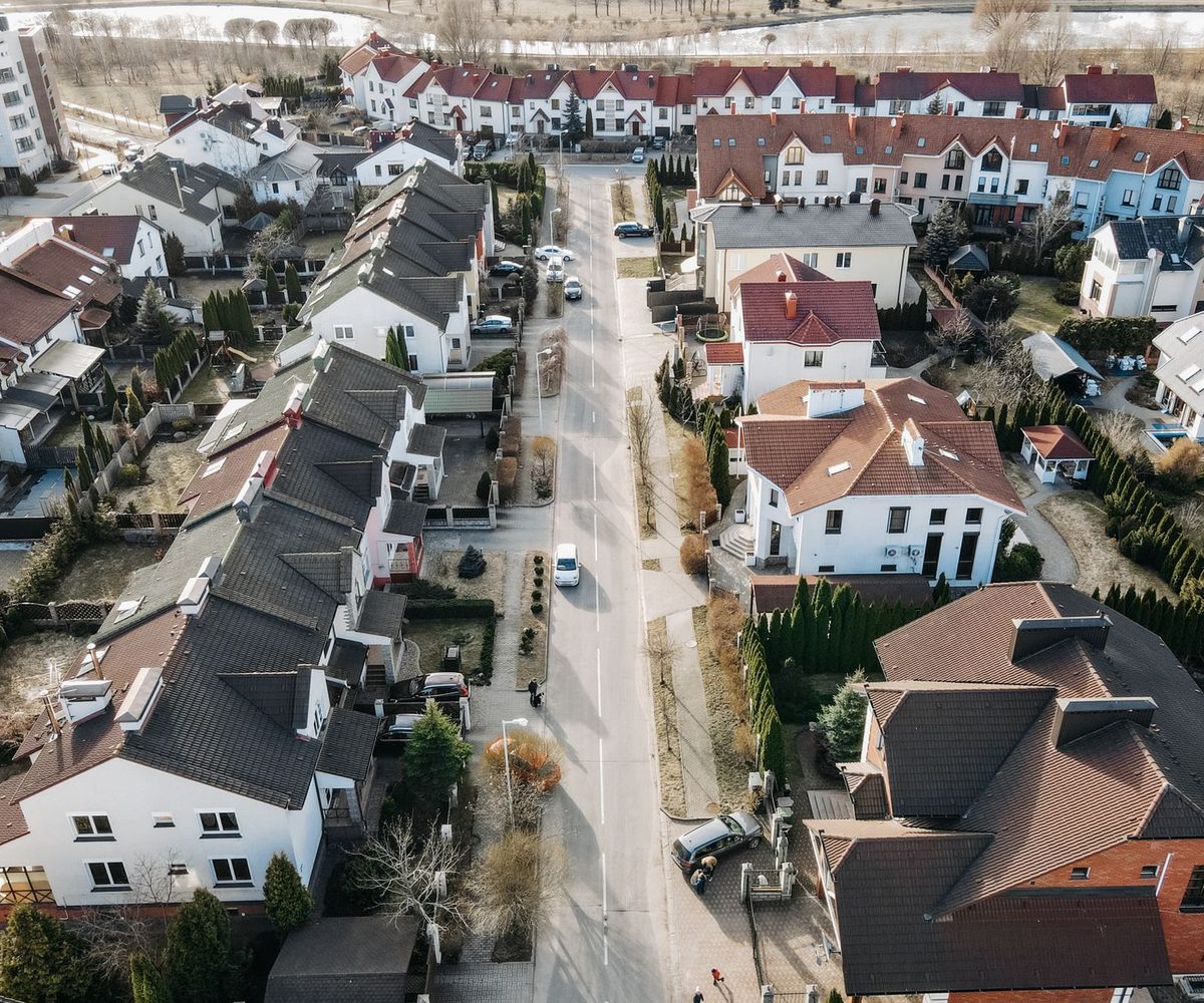 Aerial view of a suburban street of houses, the property addresses a HMDA filing has to geocode