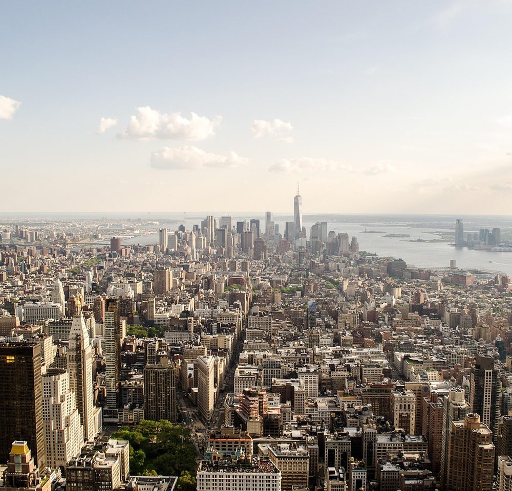 Aerial view of a dense financial district, the competitive market a peer analysis measures you against