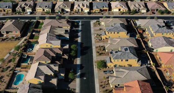 Aerial view of a suburban neighbourhood of single-family homes, the geography fair lending analysis examines