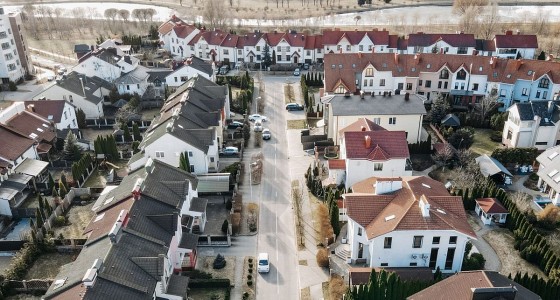 Aerial view of a suburban street of houses, the property addresses a HMDA filing has to geocode